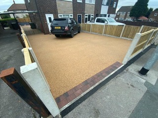 Entrance of a Alexandria coloured newly installed resin drive with parked up black range rover in Swansea