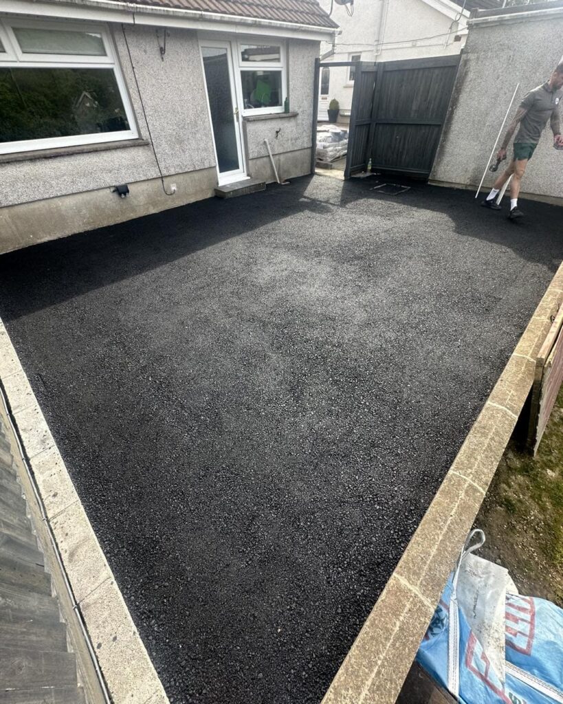Patio with tarmac surfacing in preperation for resin bound installation in Rhyd-y-fro in Pontardaawe