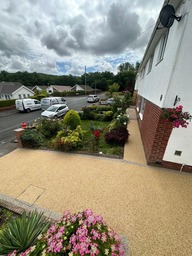 Resin bound driveway installation in Gowerton using St Tropex infil and Huka Falls border supplied by Vuba